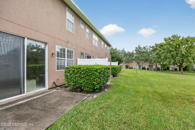 a view of a back yard of the house