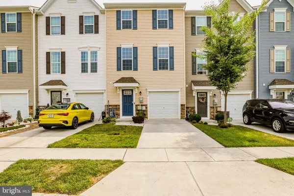 a view of a yard in front of a brick building