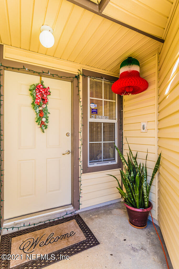 2450 Wattle Tree Road East Jacksonville, FL 32246 - Photo 4 of 24 a front view of a house with entryway