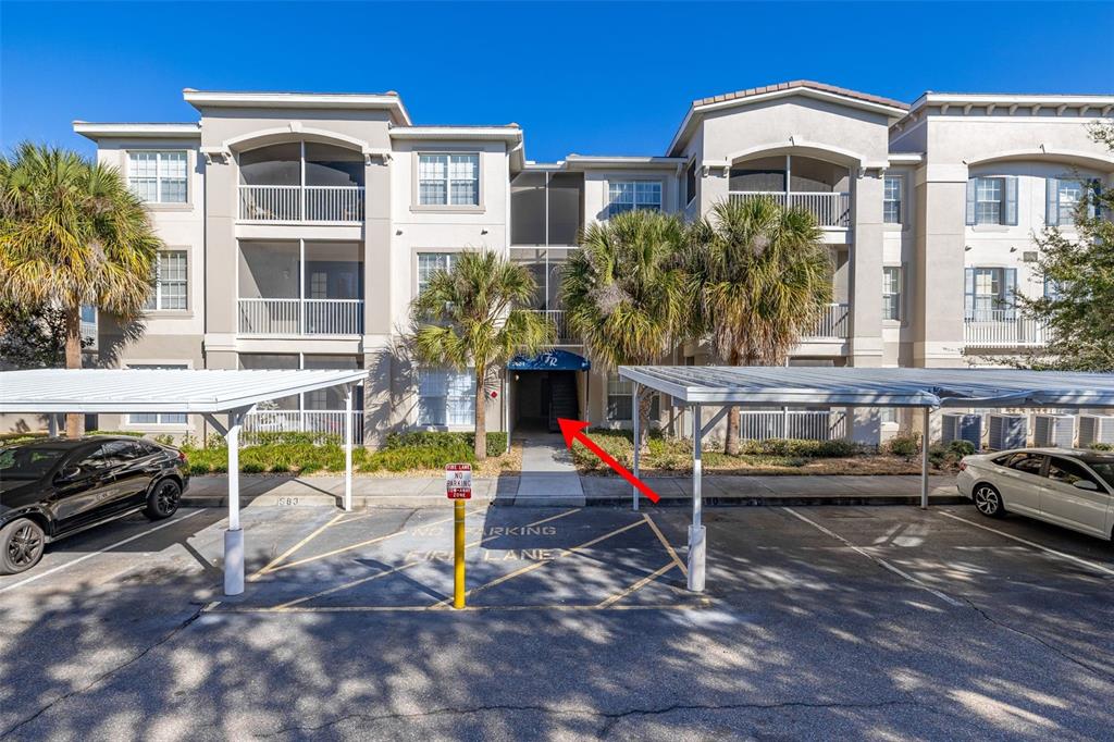 a view of a house with a yard and sitting area