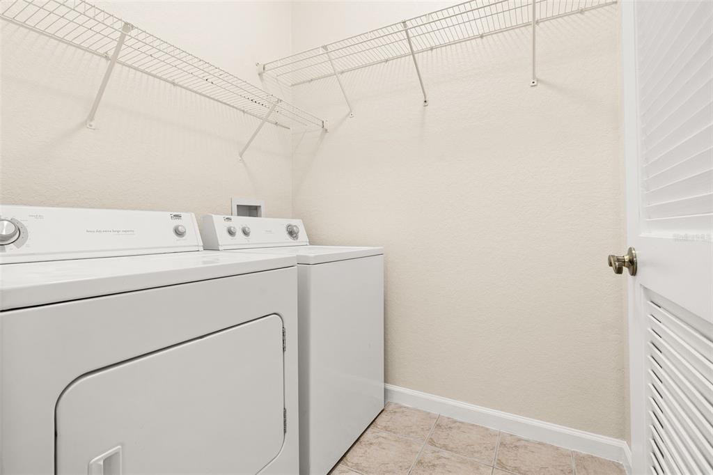 3001 Greystone Loop, Unit 106 Kissimmee, FL 34741 - Photo 17 of 27 a utility room with dryer and washer