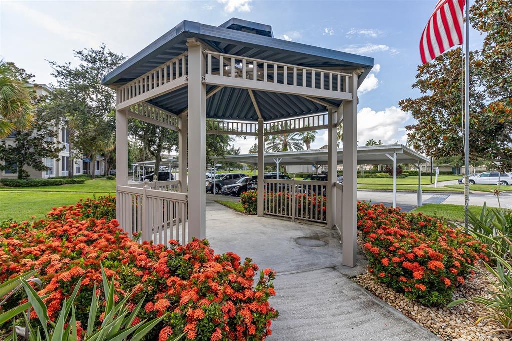 3001 Greystone Loop, Unit 106 Kissimmee, FL 34741 - Photo 27 of 27 a view of a chairs and table in backyard of the house