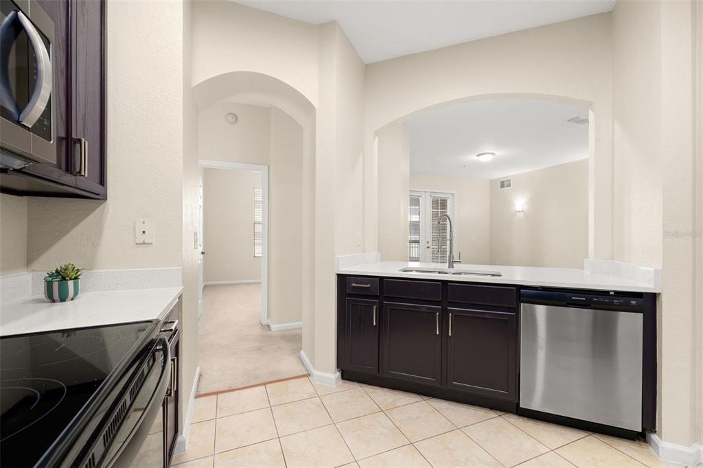 3001 Greystone Loop, Unit 106 Kissimmee, FL 34741 - Photo 6 of 27 a kitchen with a sink and cabinets
