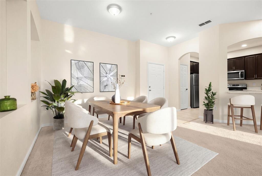 3001 Greystone Loop, Unit 106 Kissimmee, FL 34741 - Photo 9 of 27 a view of a dining room with furniture