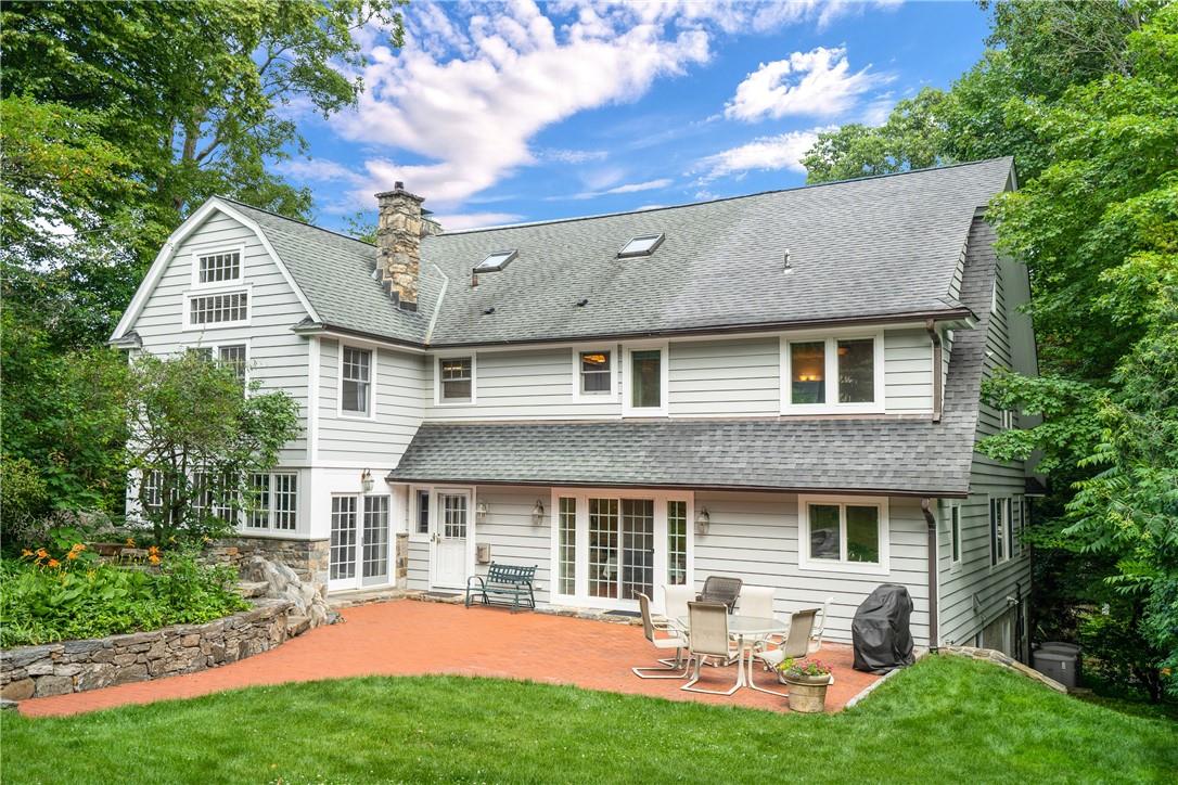 117 Edgemont Road Scarsdale, NY 10583 - Photo 1 of 1 Gracious Dutch Colonial home showing the Walbrooke entrance via a large patio. Sliding French doors from the family room can be seen on the left and double French doors with sidelights from the breakfast room can be seen at the center. Whether you enter on the Edgemont Road or Walbrooke side you will love coming home to this beautiful home!