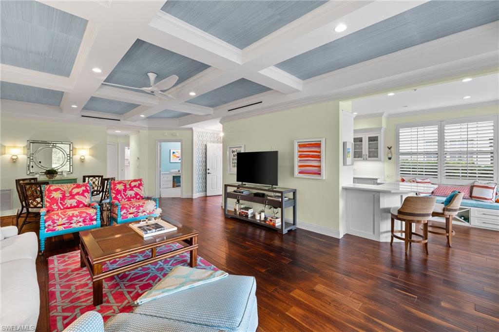 2120 Aberdeen Lane, Unit 101 Naples, FL 34109 - Photo 13 of 47 a living room with furniture and wooden floor