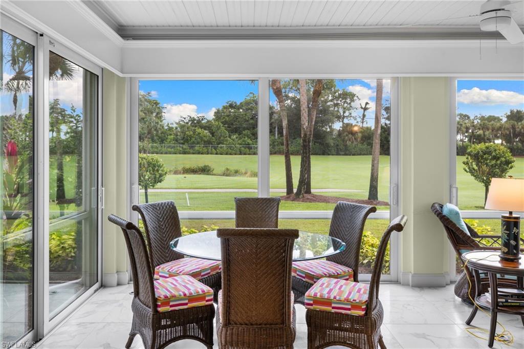 2120 Aberdeen Lane, Unit 101 Naples, FL 34109 - Photo 24 of 47 a view of a dining room with furniture window and outside view