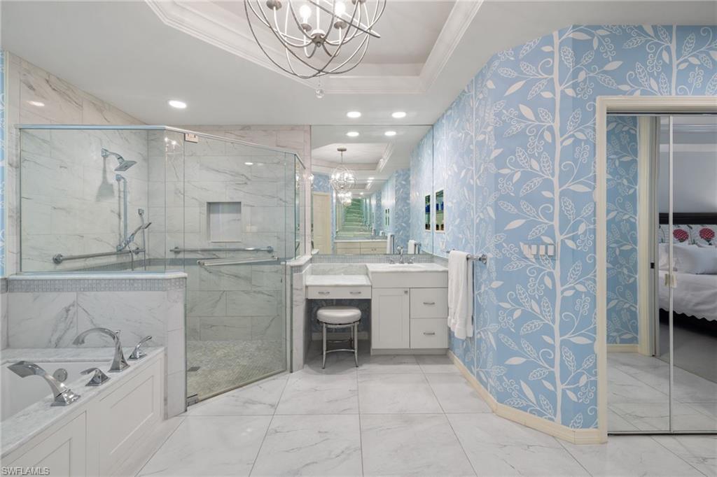 2120 Aberdeen Lane, Unit 101 Naples, FL 34109 - Photo 29 of 47 a bathroom with a sink a toilet and shower