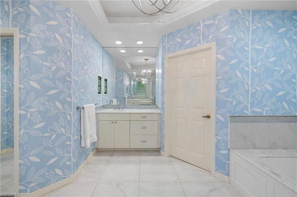 2120 Aberdeen Lane, Unit 101 Naples, FL 34109 - Photo 30 of 47 a bathroom with a sink a toilet and shower