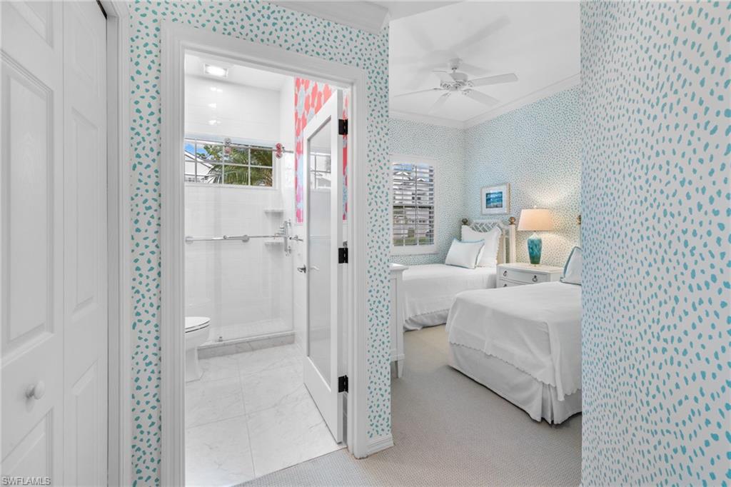 2120 Aberdeen Lane, Unit 101 Naples, FL 34109 - Photo 32 of 47 a bedroom with furniture and a window