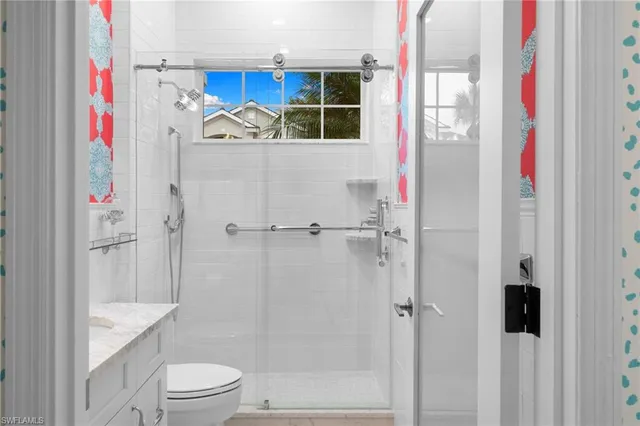 a bathroom with a shower and a toilet