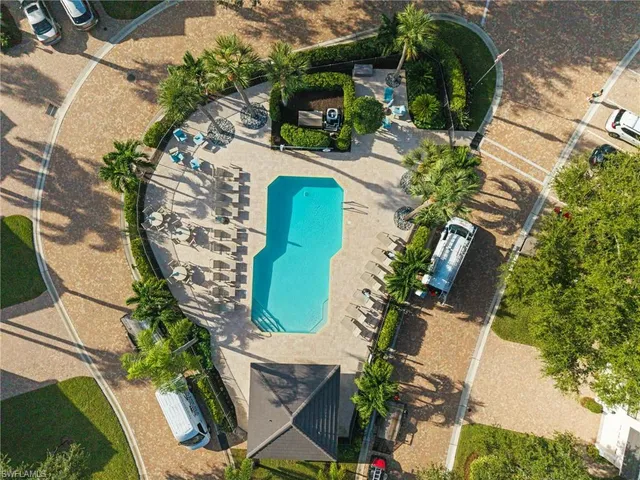an aerial view of a house with a yard and garden
