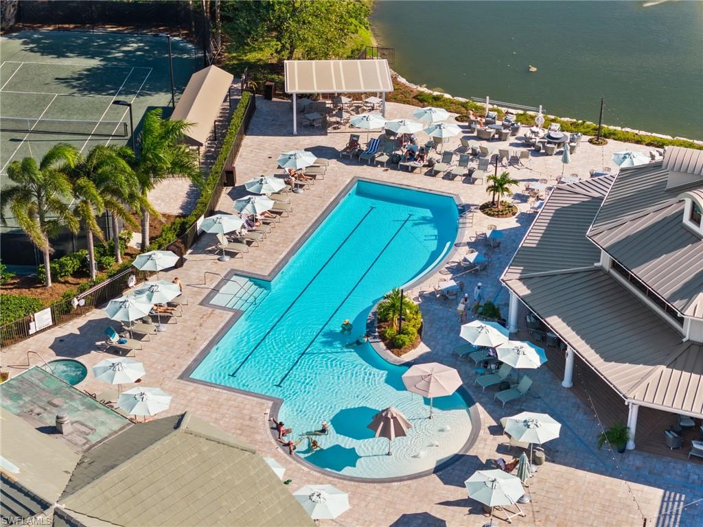 2120 Aberdeen Lane, Unit 101 Naples, FL 34109 - Photo 42 of 47 a view of a dining room with furniture and wooden floor