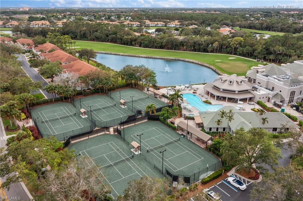 2120 Aberdeen Lane, Unit 101 Naples, FL 34109 - Photo 44 of 47 an aerial view of a house with a lake view