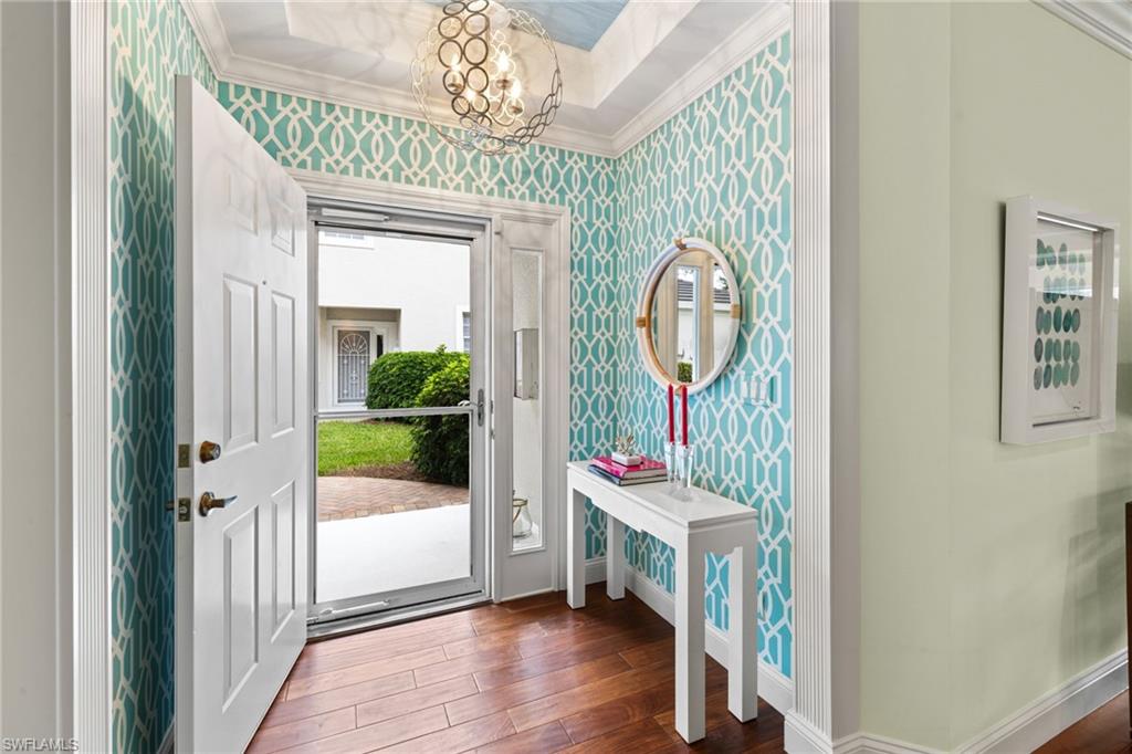 2120 Aberdeen Lane, Unit 101 Naples, FL 34109 - Photo 6 of 47 a front view of a house with garden