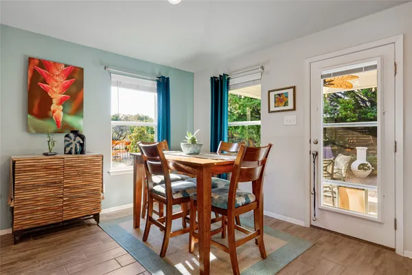 a view of a dining room with furniture window and outside view