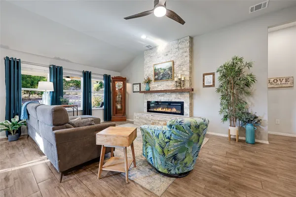 a living room with furniture and a fireplace