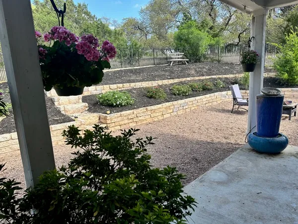 a view of a garden with flowers and flowers