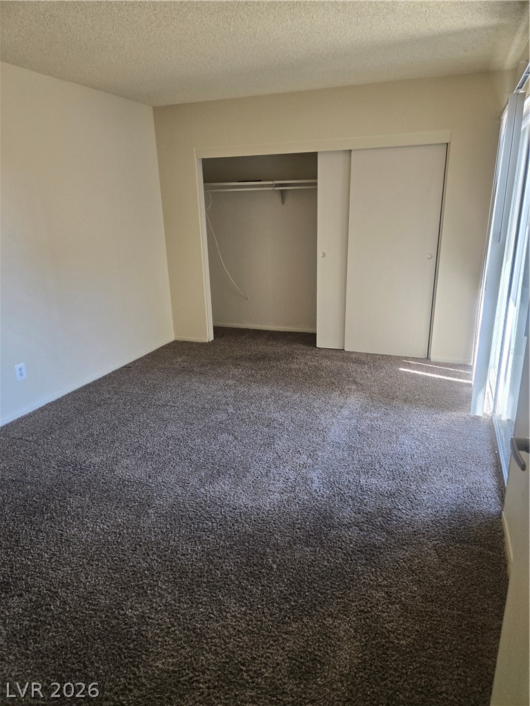 1388 East Desert Inn Road, Unit 2 Las Vegas, NV 89169 - Photo 2 of 23 Functional loft space features ample carpeted flooring, awaiting your personalized touch.