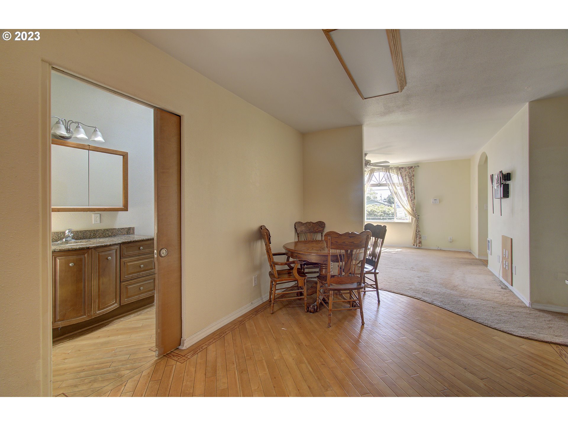 271 28th Avenue Longview, WA 98632 - Photo 11 of 29 a open hall with cabinets and wooden floor