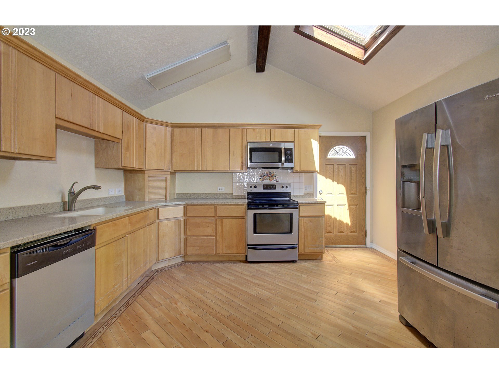 271 28th Avenue Longview, WA 98632 - Photo 13 of 29 a kitchen with stainless steel appliances a refrigerator stove and sink