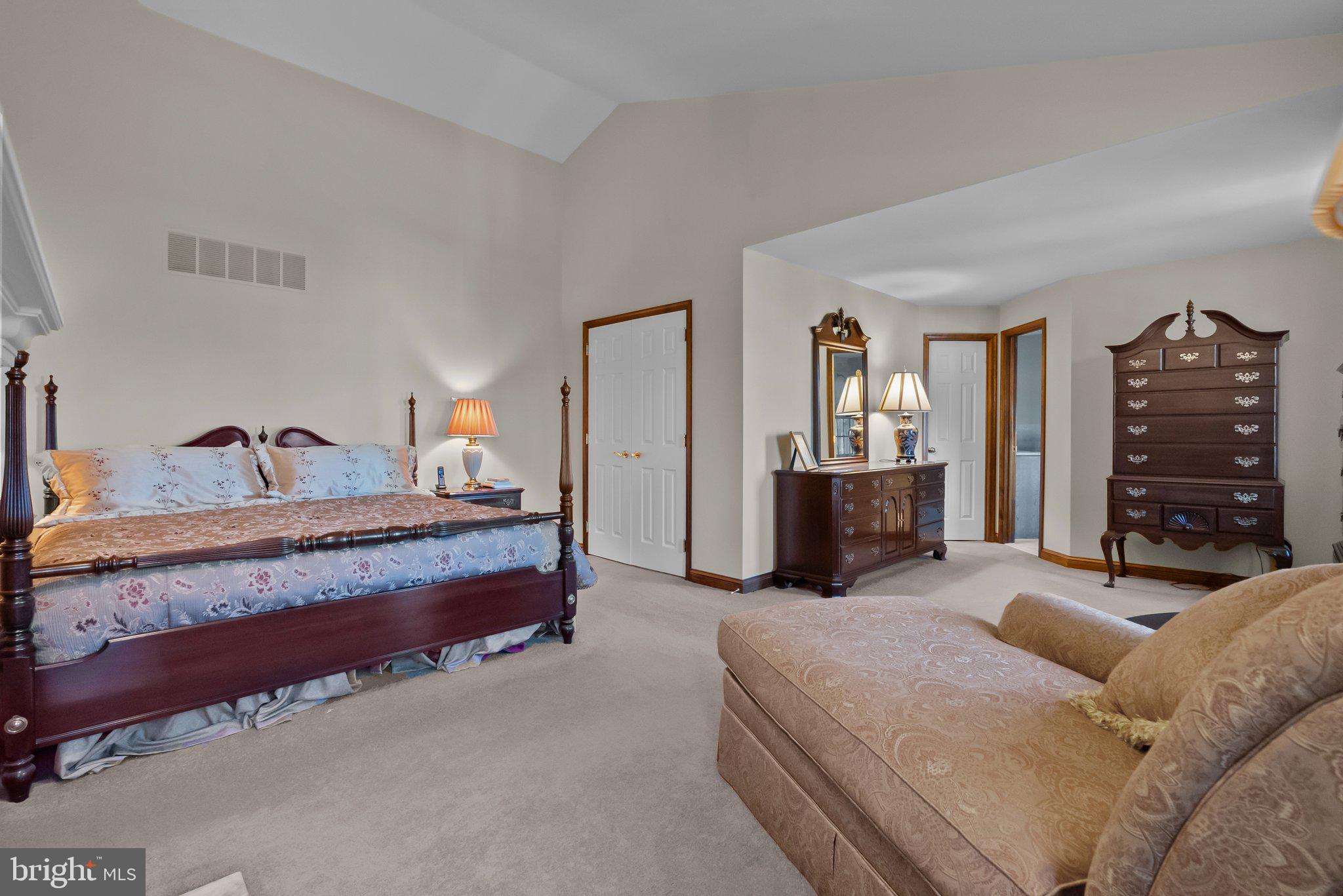 26 Hidden Turn Newtown, PA 18940 - Photo 19 of 40 a spacious bedroom with a bed and dresser