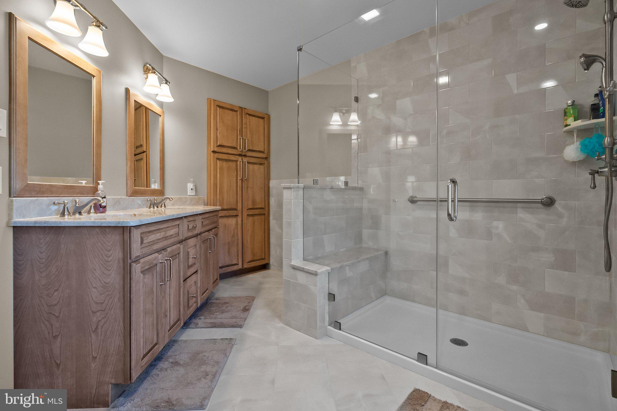 26 Hidden Turn Newtown, PA 18940 - Photo 21 of 40 a bathroom with a shower sink and mirror