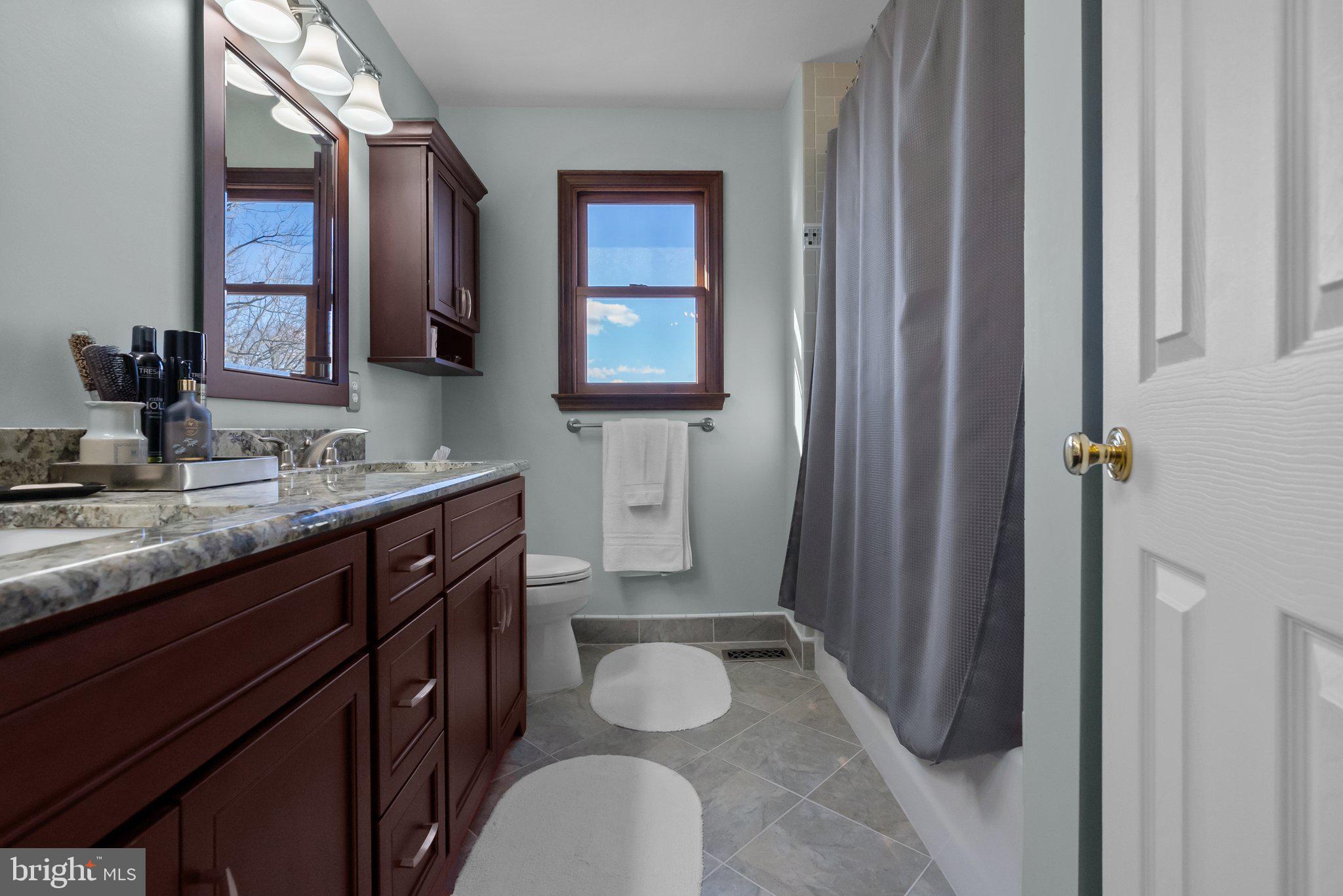 26 Hidden Turn Newtown, PA 18940 - Photo 26 of 40 a bathroom with a granite countertop sink toilet and shower