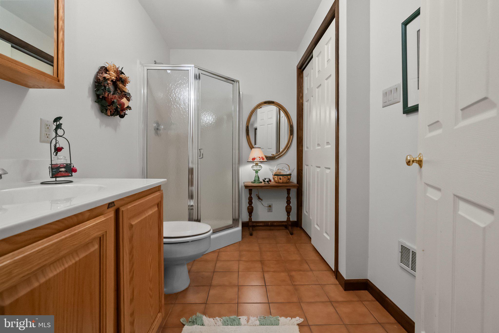 26 Hidden Turn Newtown, PA 18940 - Photo 32 of 40 a bathroom with a sink a toilet and a mirror