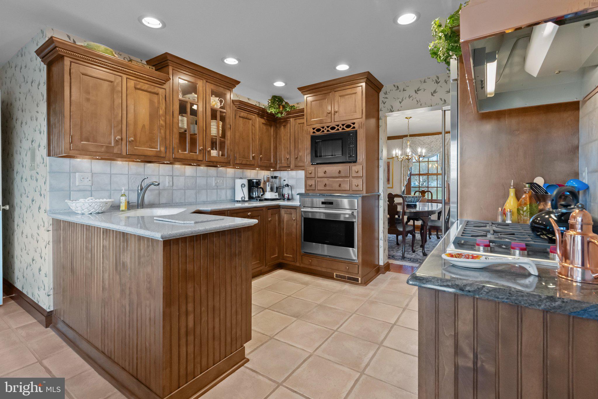 26 Hidden Turn Newtown, PA 18940 - Photo 6 of 40 a kitchen with stainless steel appliances granite countertop a sink counter space and cabinets
