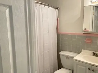 a kitchen with a sink a stove and cabinets
