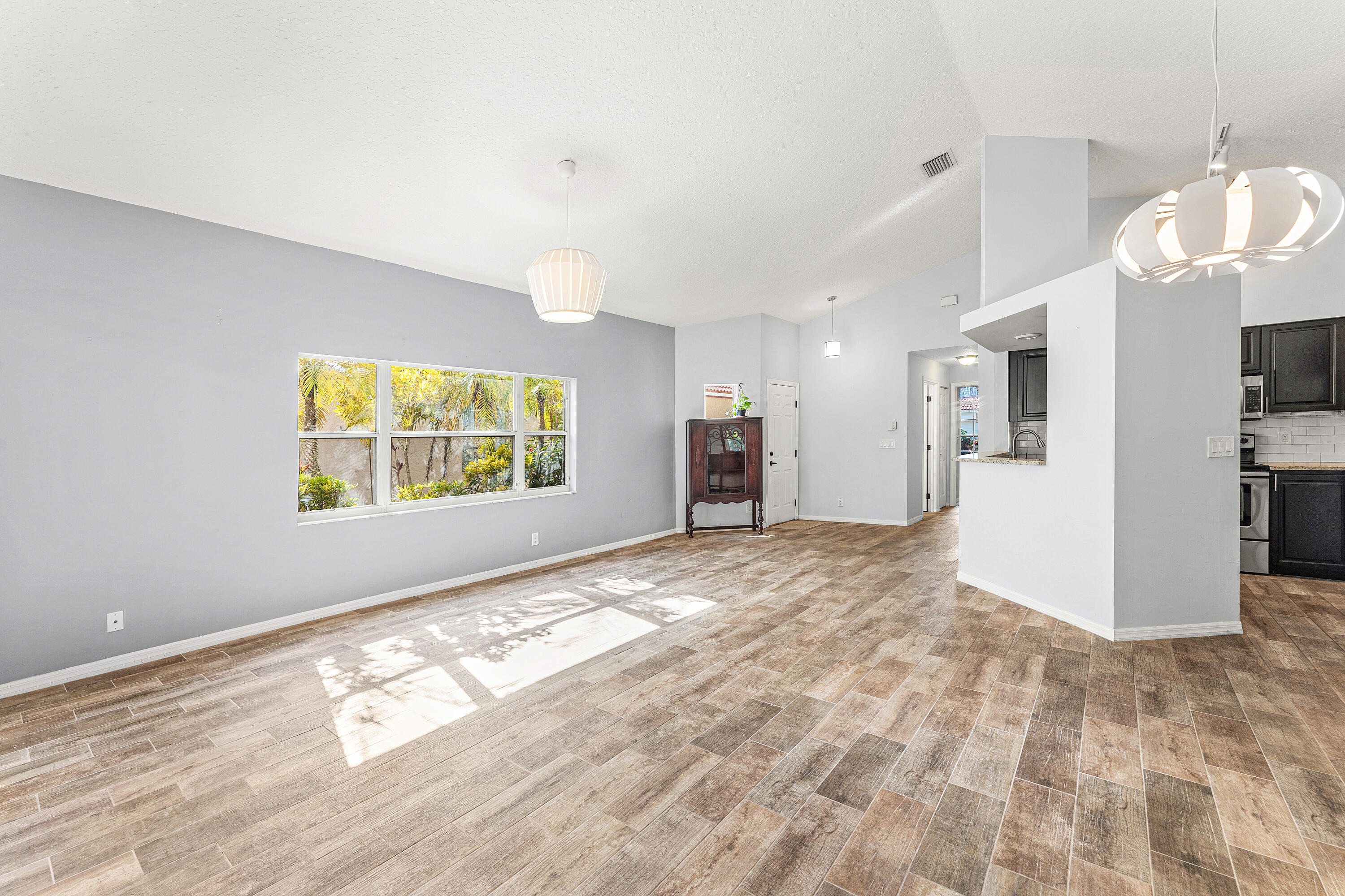 2100 Bonisle Circle Riviera Beach, FL 33418 - Photo 13 of 24 a view of an empty room and kitchen view