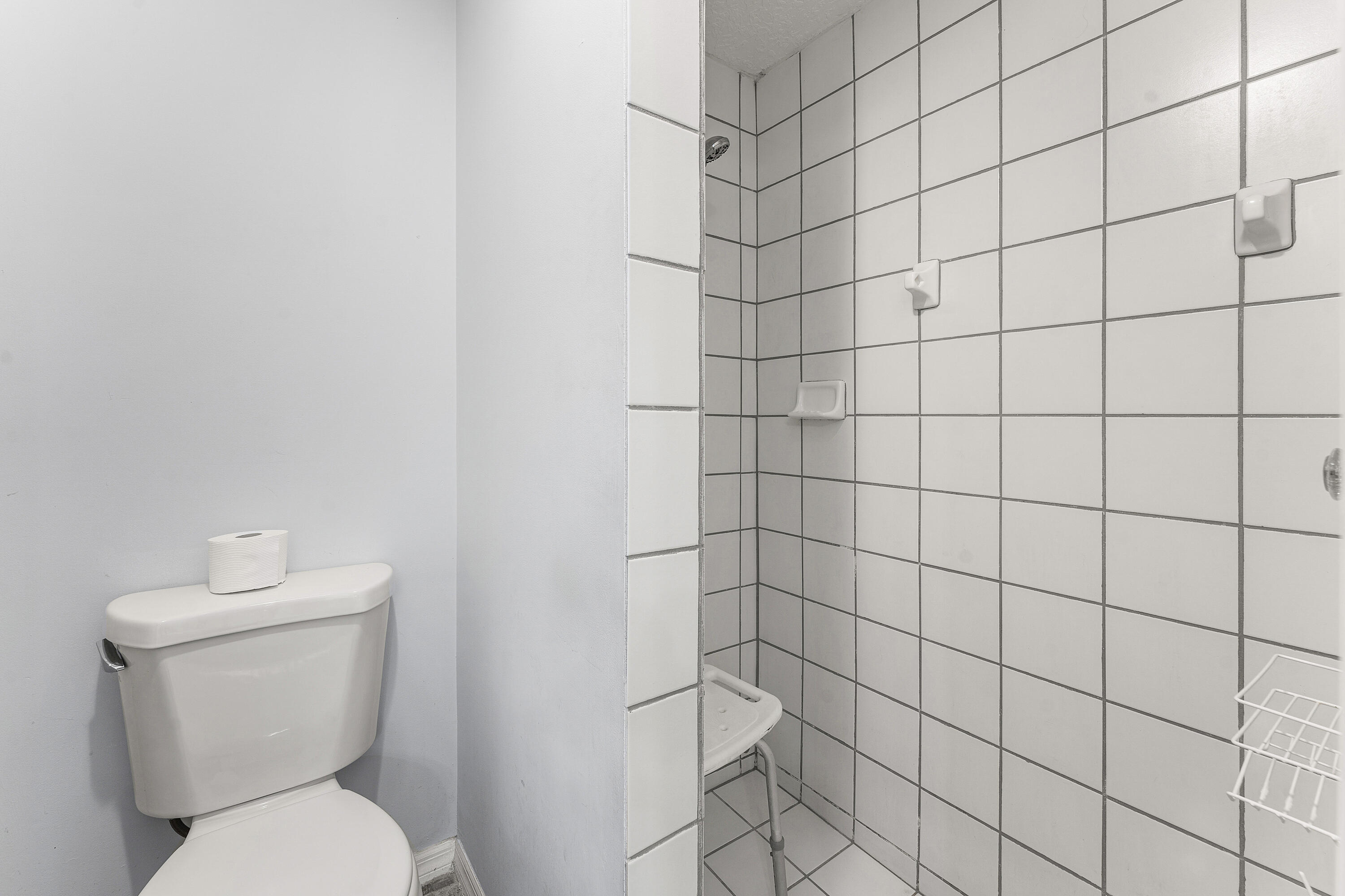 2100 Bonisle Circle Riviera Beach, FL 33418 - Photo 17 of 24 a white toilet sitting next to a white wall