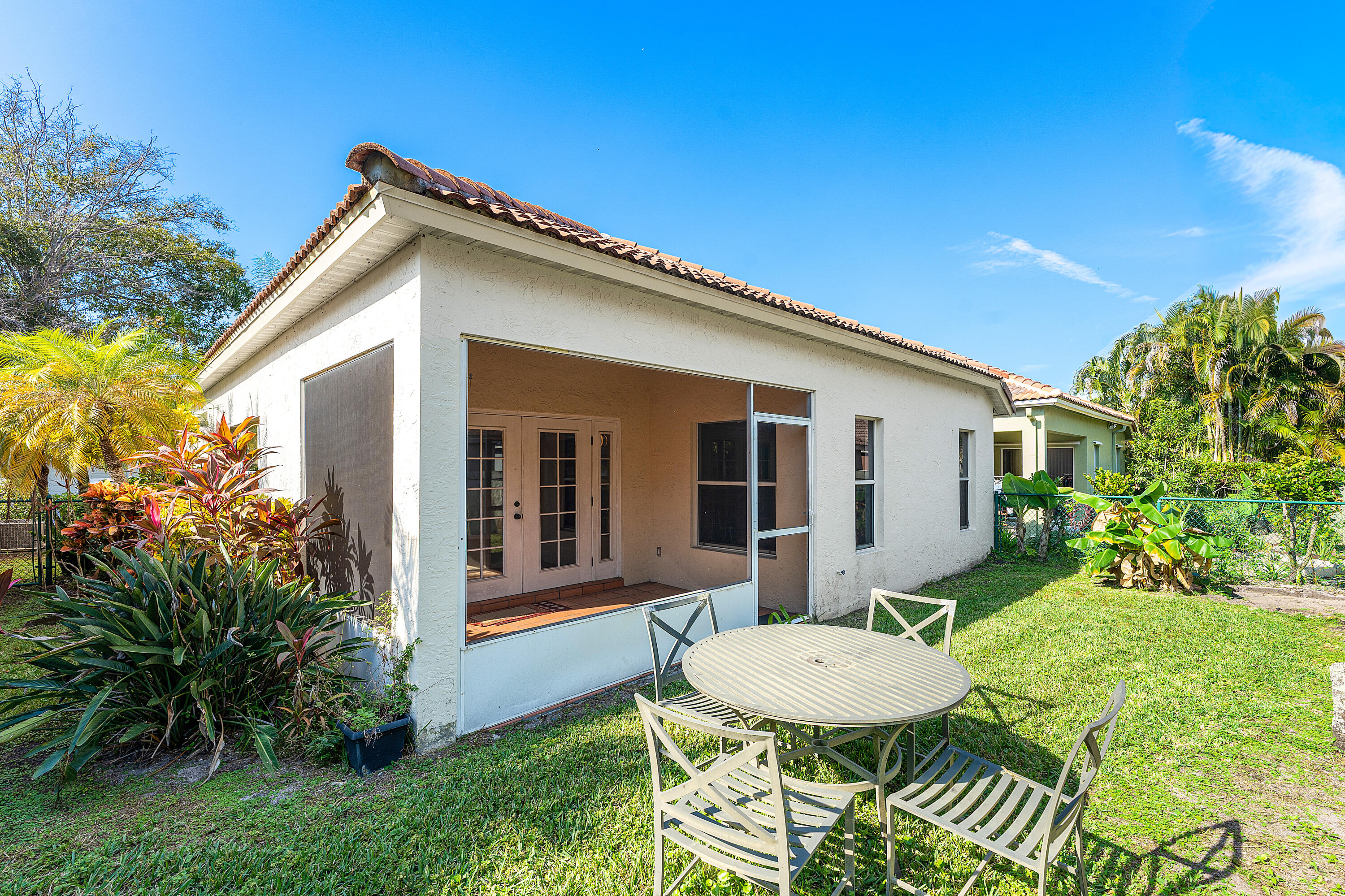 2100 Bonisle Circle Riviera Beach, FL 33418 - Photo 18 of 24 a view of a house with a backyard