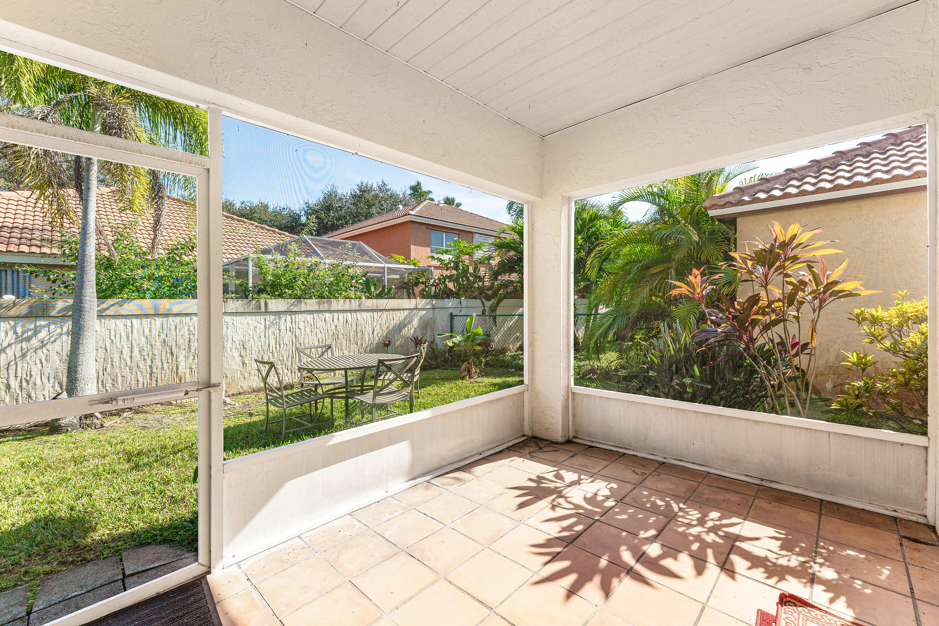 2100 Bonisle Circle Riviera Beach, FL 33418 - Photo 21 of 24 a view of a garden from a windows