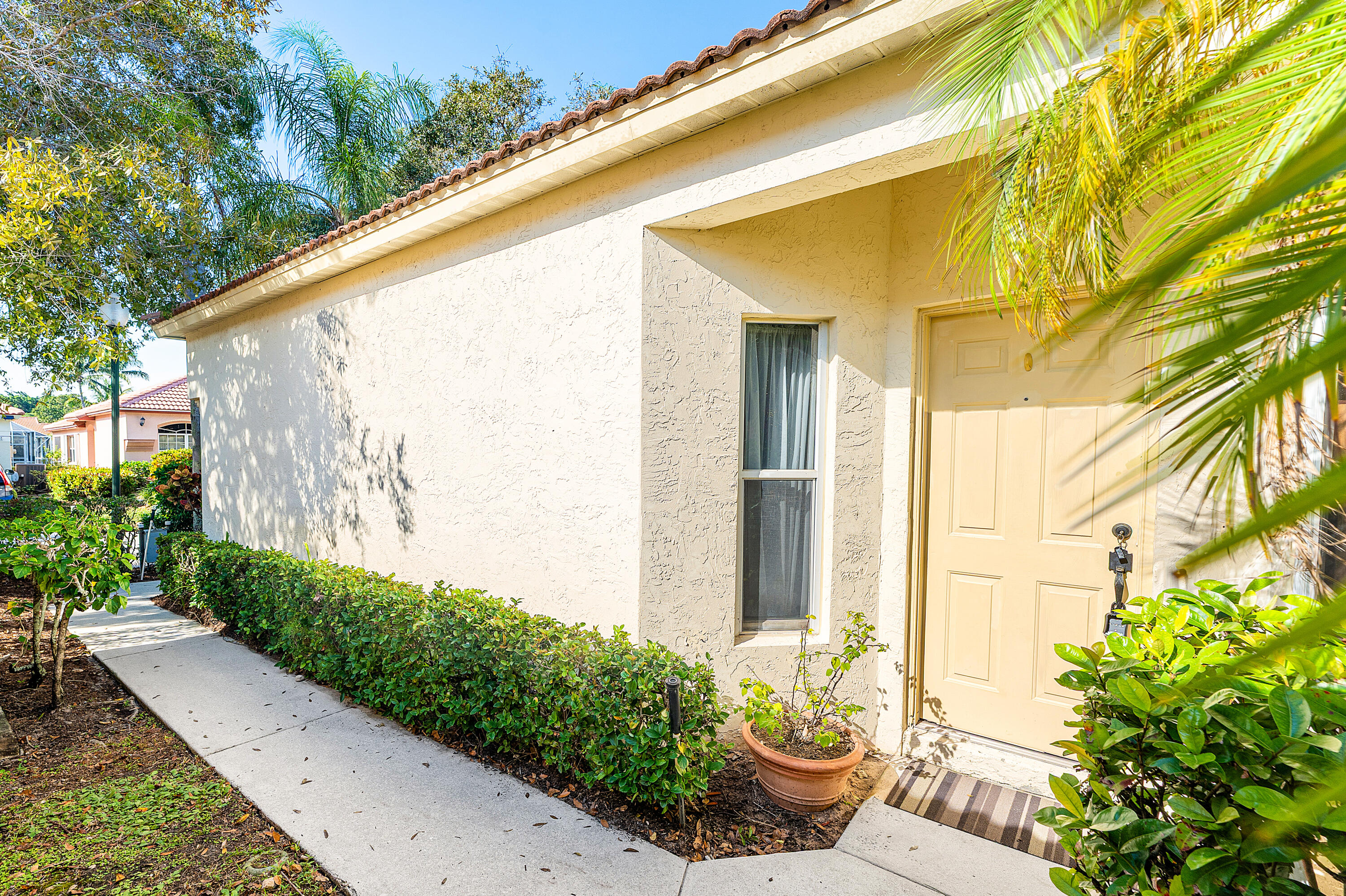 2100 Bonisle Circle Riviera Beach, FL 33418 - Photo 3 of 24 a view of a back yard of the house