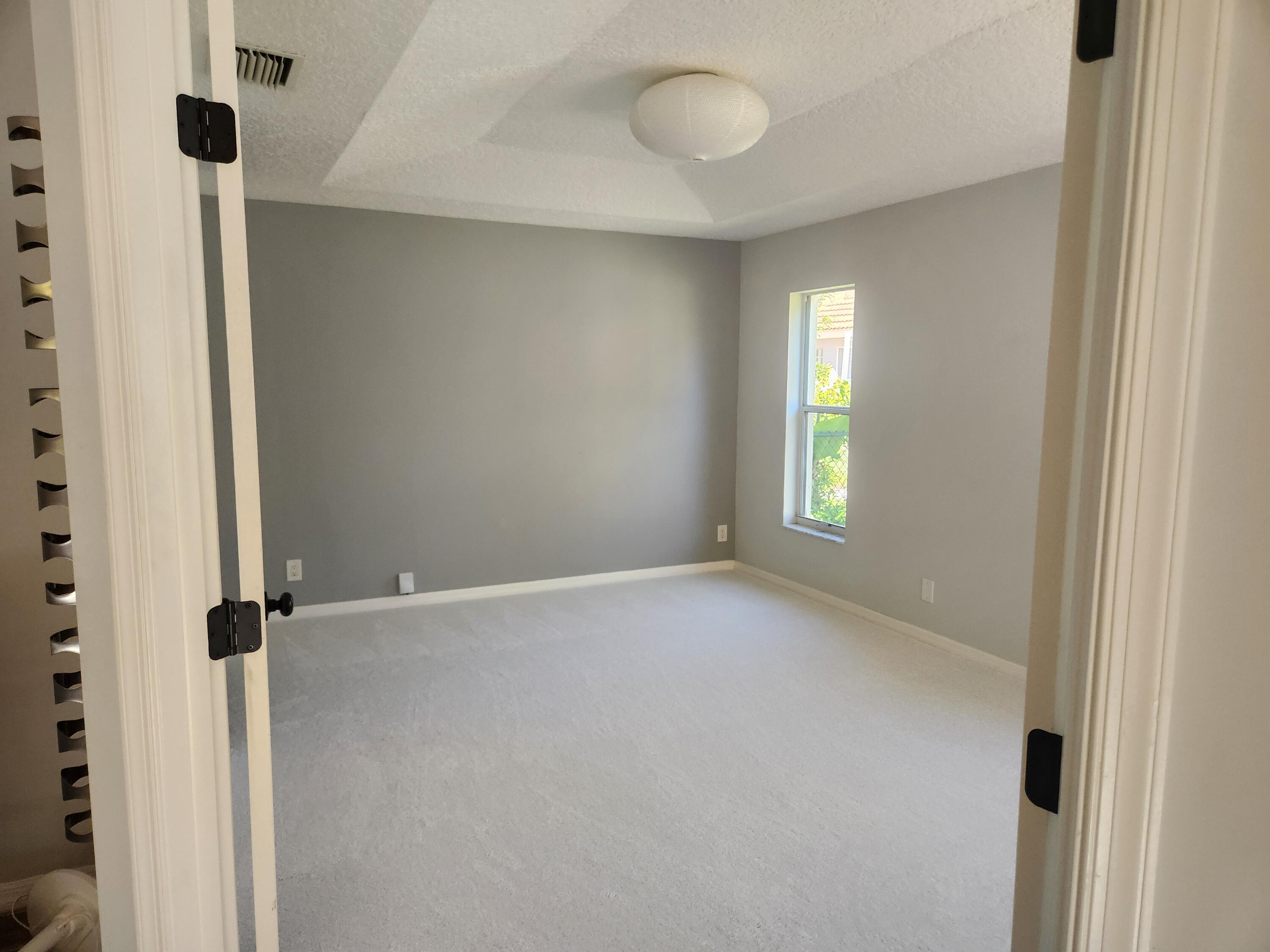 2100 Bonisle Circle Riviera Beach, FL 33418 - Photo 6 of 24 a view of an empty room with a window