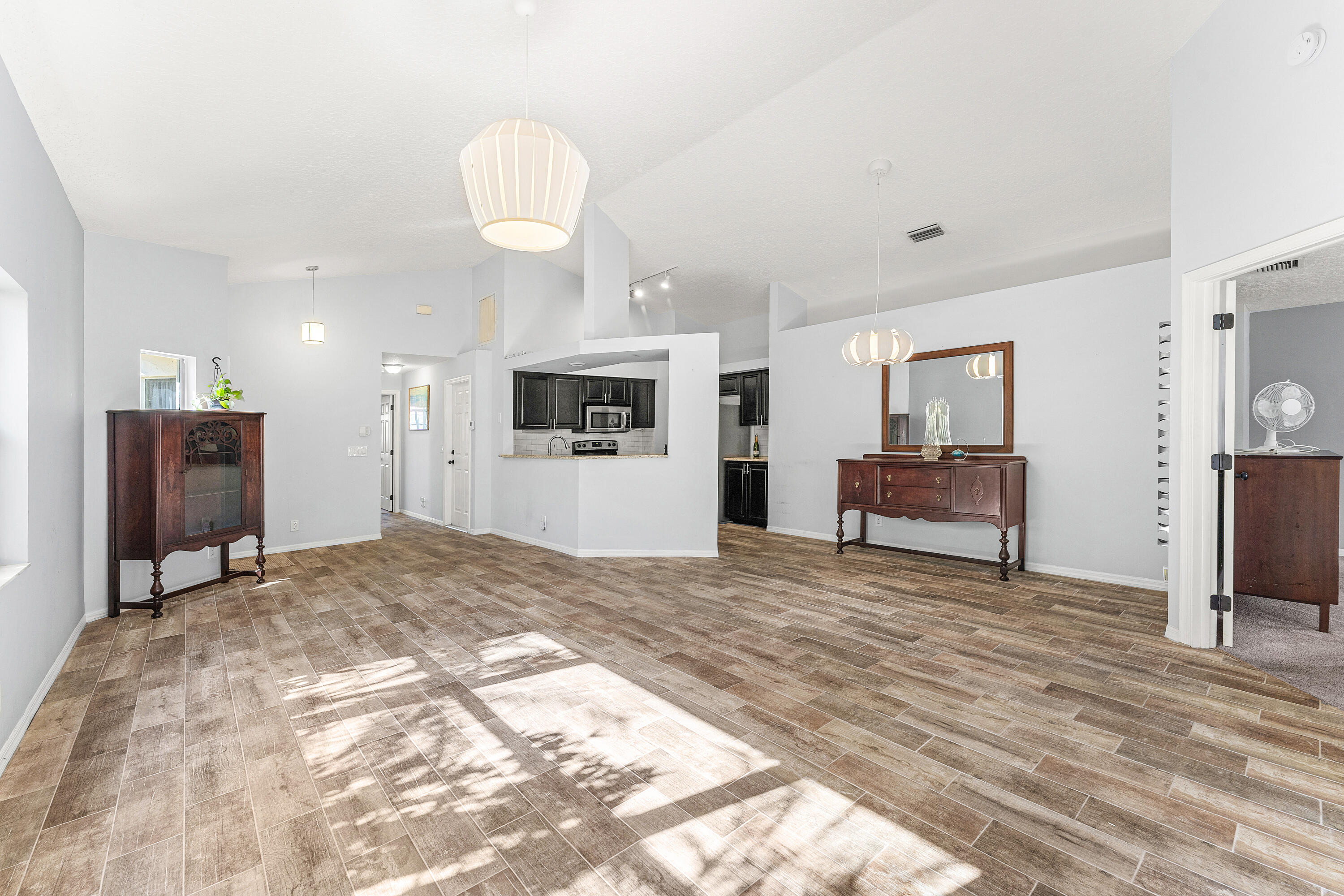 2100 Bonisle Circle Riviera Beach, FL 33418 - Photo 7 of 24 a view of kitchen with sink microwave and refrigerator