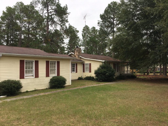 3334 Hamlin Road Lizella, GA 31052 - Photo 2 of 11 a house view with a sitting space and garden