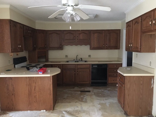 3334 Hamlin Road Lizella, GA 31052 - Photo 6 of 11 a kitchen with a sink a stove and cabinets