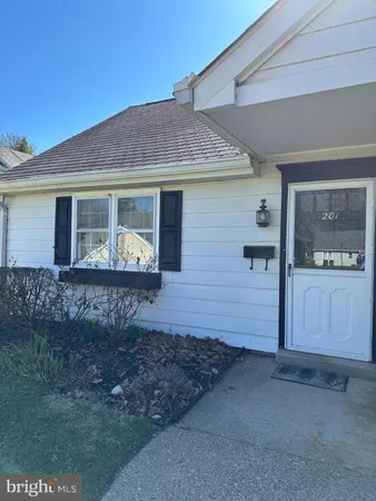 a front view of a house with yard