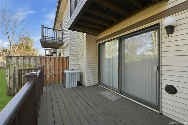 a view of a balcony with wooden floor