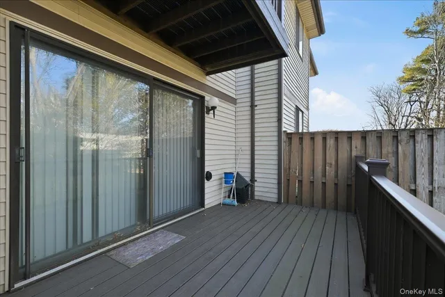 a view of outdoor space with wooden floor and stairs
