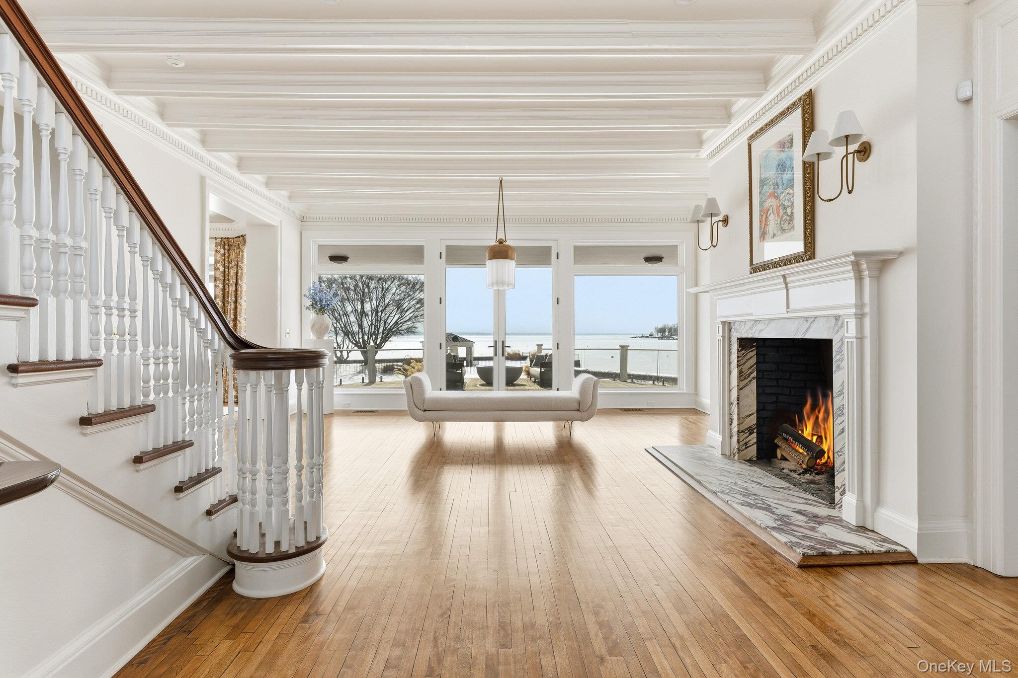 217 Hommocks Road Larchmont, NY 10538 - Photo 19 of 49 Living area with light wood-style flooring, a fireplace, and crown molding