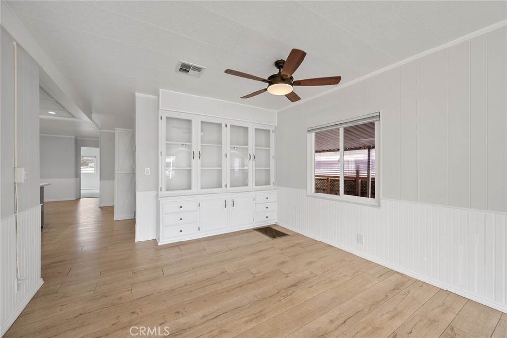 1675 Los Osos Valley Road, Unit 135 Los Osos, CA 93402 - Photo 13 of 38 a view of an empty room with window and wooden floor
