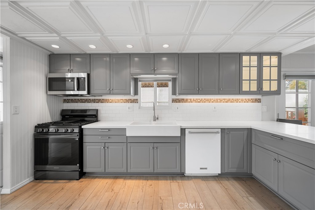 1675 Los Osos Valley Road, Unit 135 Los Osos, CA 93402 - Photo 15 of 38 a kitchen with a sink stove and refrigerator