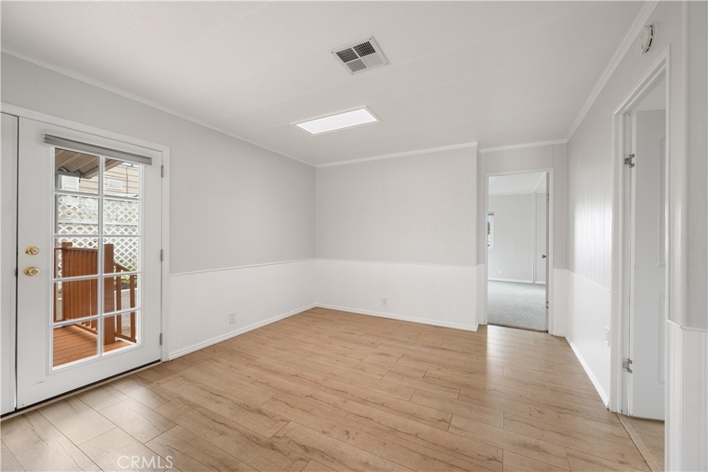 1675 Los Osos Valley Road, Unit 135 Los Osos, CA 93402 - Photo 17 of 38 an empty room with wooden floor and windows