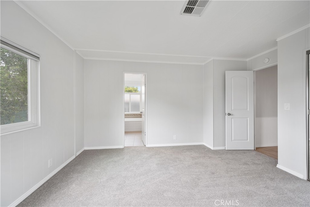 1675 Los Osos Valley Road, Unit 135 Los Osos, CA 93402 - Photo 21 of 38 an empty room with windows