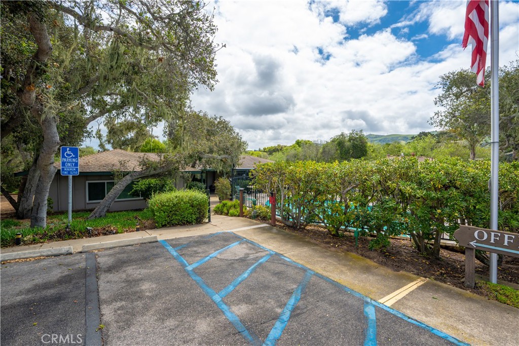 1675 Los Osos Valley Road, Unit 135 Los Osos, CA 93402 - Photo 36 of 38 a view of a garden with a building in the background