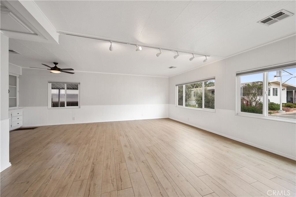 1675 Los Osos Valley Road, Unit 135 Los Osos, CA 93402 - Photo 8 of 38 wooden floor in an empty room with a window